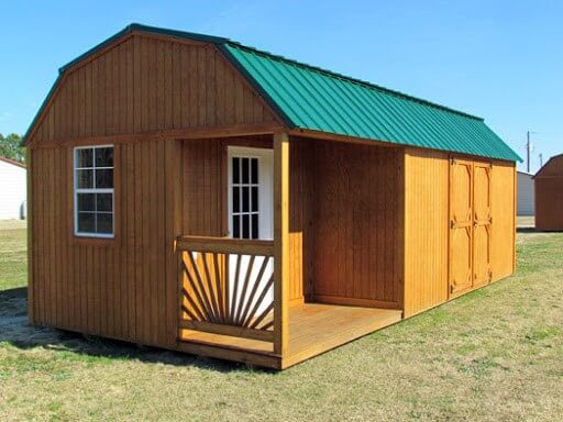 Wood storage shed with porch and green metal roof