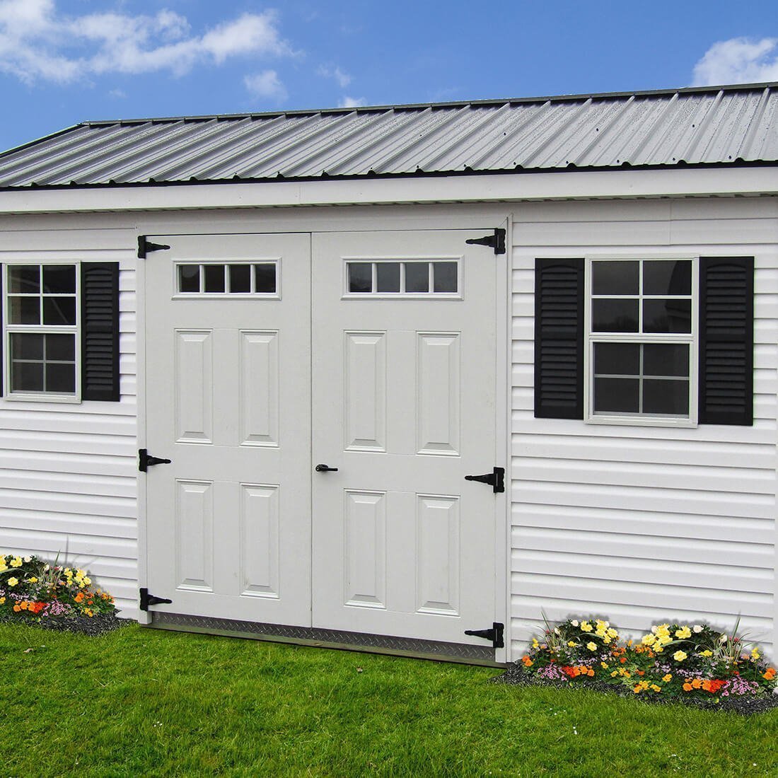 White cape cod cottage shed with black trim